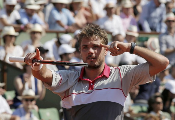 Stan Wawrinka of Switzerland celebrates after defeating Jo-Wilfried Tsonga of France during their men&#039;s semi-final match at the French Open tennis tournament at the Roland Garros stadium in Paris ...