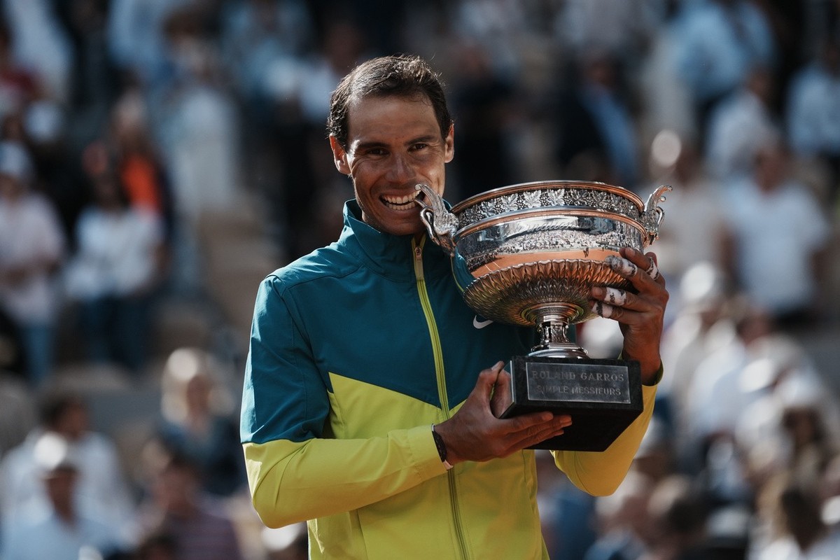Spain's Rafael Nadal bites the cup after defeating Norway's Casper Ruud in their final match of the French Open tennis tournament at the Roland Garros stadium Sunday, June 5, 2022 in Paris.  ...