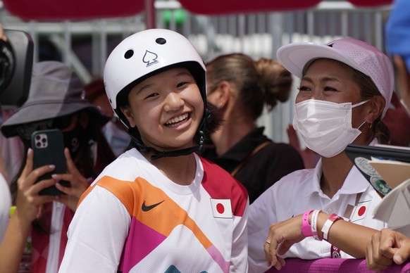 Gold medal winner Momiji Nishiya of Japan smiles after winning the women&#039;s street skateboarding finals at the 2020 Summer Olympics, Monday, July 26, 2021, in Tokyo, Japan. (AP Photo/Ben Curtis)
M ...