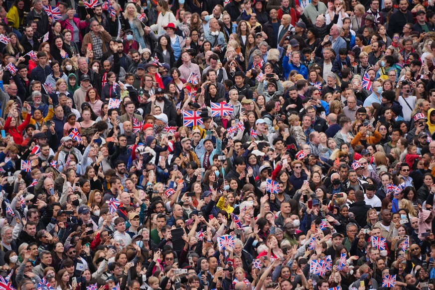 Crowds line The Mall during the Platinum Jubilee Pageant outside Buckingham Palace in London, Sunday June 5, 2022, on the last of four days of celebrations to mark the Platinum Jubilee. The pageant wi ...