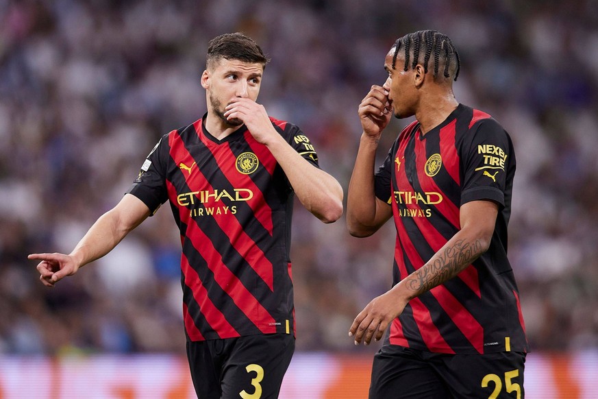 Mandatory Credit: Photo by Ruben Albarran/Shutterstock 13905826gv Ruben Dias and Manuel Akanji of Manchester City FC Real Madrid v Manchester City, UEFA Champions League, Semi-final, Football, Santiag ...