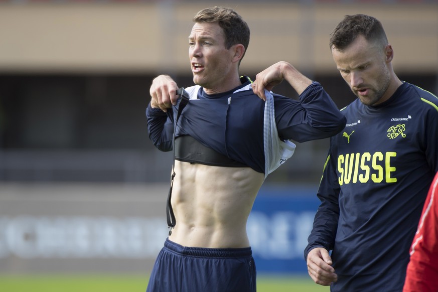 epa07905306 Switzerland's national soccer team player Stephan Lichtsteiner, left, and Haris Seferovic, right, during a training session before the upcoming UEFA Euro 2020 qualifying soccer matchs, at  ...