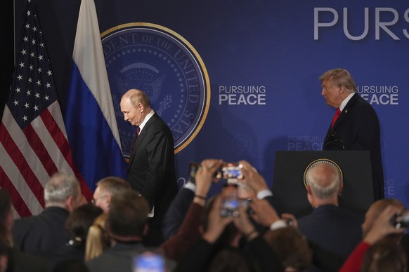 President Donald Trump, right, and Russia&#039;s President Vladimir Putin depart at the conclusion of a joint press conference at Joint Base Elmendorf-Richardson, Alaska, Friday, Aug. 15, 2025. (AP Ph ...