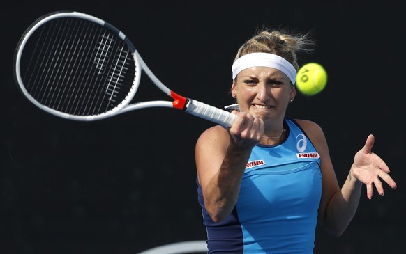 Switzerland&#039;s Timea Bacsinszky makes a forehand return to Italy&#039;s Camila Giorgi during their first round match at the Australian Open tennis championships in Melbourne, Australia, Tuesday, J ...