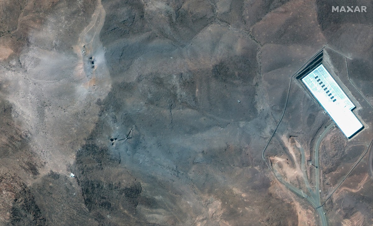 epa12190792 A handout satellite image made available by Maxar Technologies shows a closer view of craters and ash on a ridge at the Fordo underground uranium enrichment following US airstrikes, in Ira ...