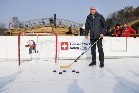 Switzerland's Federal Councillor and President Alain Berset reacts as he play ice hockey at the House of Switzerland during the XXIII Winter Olympics 2018 in Pyeongchang, South Korea, on Saturday, February 10, 2018. (KEYSTONE/Jean-Christophe Bott)