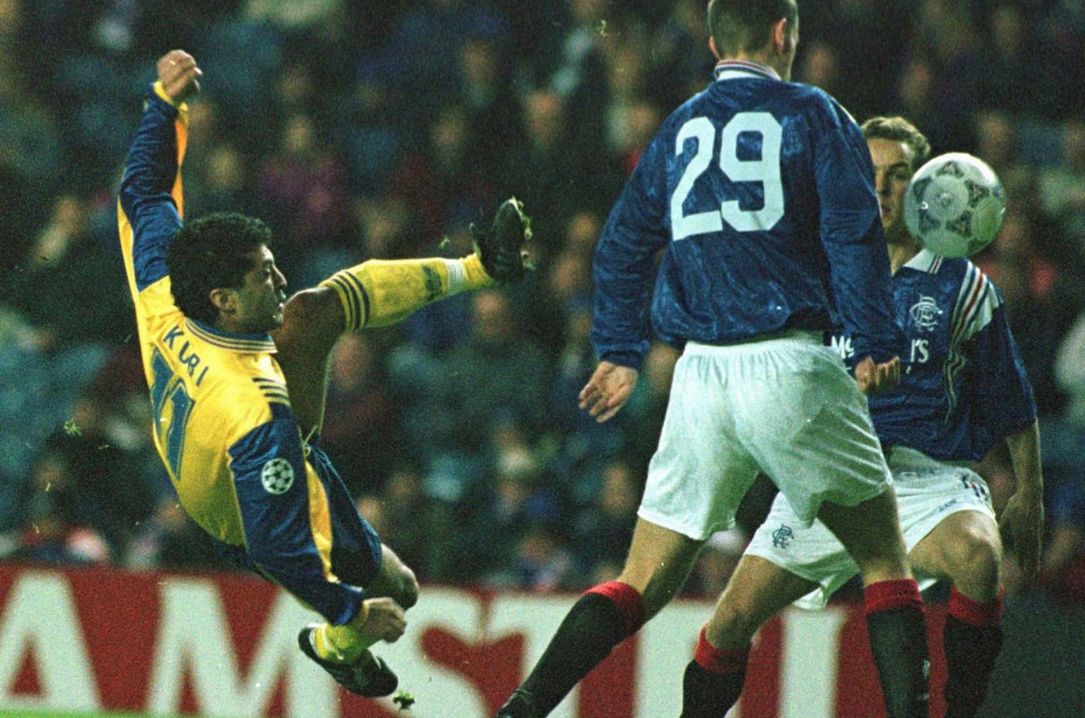 Kubilay Tuerkyilmaz (left) from Grasshoppers Zuerich fires a shot at the goal whilst Glasgow Rangers player Scott Wilson (29) looks on during the UEFA Champions League game between Glasgow Rangers and ...