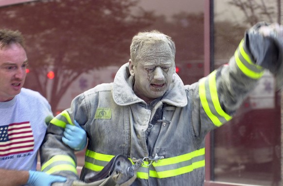 Firefighter covered with ash after World Trade Center collap
UNITED STATES - SEPTEMBER 11: Firefighter covered with ash after World Trade Center collapsed in terrorist attack. (Photo by Thomas Monaste ...