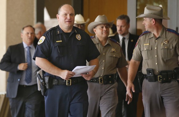 Odessa Police Chief Michael Gerke, left, arrives for a news conference with other officials Monday, Sept. 2, 2019, in Odessa, Texas. The gunman in a spate of violence after a traffic stop in West Texa ...