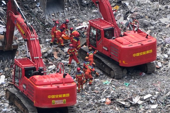 Rescuers recover a trapped victim from the rubble at the scene of a landslide in Pengshui County in southwestern China's Chongqing area on Sunday, July 19, 2026. (AP Photo/Andy Wong)
China Landsl ...