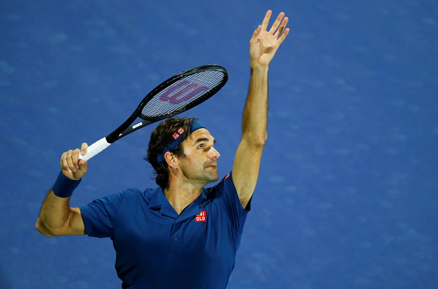 epa07397072 Roger Federer of Switzerland in action against Philipp Kohlschreiber of Germany during their first round match at the Dubai Duty Free Tennis ATP Championships 2019 in Dubai, United Arab Em ...