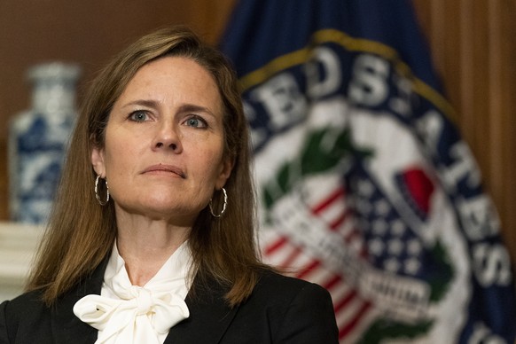 FILE - In this Oct. 1, 2020, file photo President Donald Trump&#039;s Supreme Court nominee Judge Amy Coney Barrett listens as Sen. Jerry Moran, R-Kan., not shown, speaks during their meeting on Capit ...