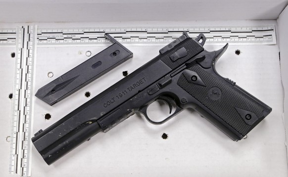 FILE – This Nov. 26, 2014, file photo shows a pellet gun resembling a Colt 1911 pistol that was taken from Tamir Rice after he was fatally shot by a Cleveland police officer, displayed after a news conference in Cleveland. Samaria Rice, whose 12-year-old son Tamir was fatally shot by a white Cleveland police officer on Nov. 22, 2014, told The Associated Press on Wednesday, Nov. 16, 2016, that she's trying to find a path forward for her family, and working to create a foundation in Tamir's name using part of a $6 million settlement with the city. (AP Photo/Mark Duncan, File)