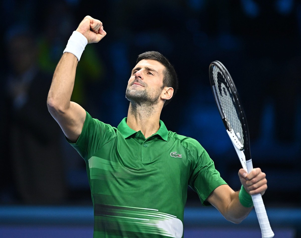 epa10306070 Novak Djokovic of Serbia celebrates after winning the match against Stefanos Tsitsipas of Greece at the Nitto ATP Finals 2022 tennis tournament at the Pala Alpitour arena in Turin, Italy,  ...