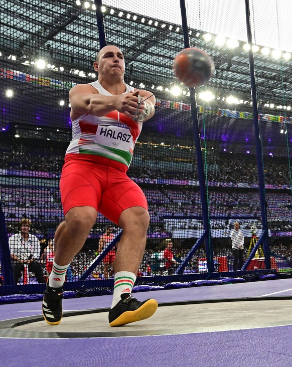 epa11526405 Bence Halasz of Hungary competes in the Men Hammer Throw final of the Athletics competitions in the Paris 2024 Olympic Games, at the Stade de France stadium in Saint Denis, France, 04 Augu ...