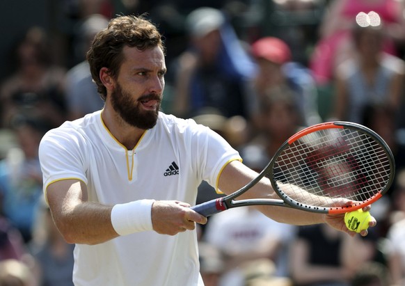 Latvia&#039;s Ernests Gulbis prepares to serve to Argentina&#039;s Juan Martin Del Potro during their Men&#039;s Singles Match at the Wimbledon Tennis Championships in London Thursday, July 6, 2017. ( ...