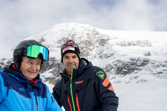 Didier Defago, right, former ski racer from Switzerland and designer of the slope, reacts with Franz Julen, left, President of the Organising Committee front of the new ski slope &quot;Gran Becca&quot ...