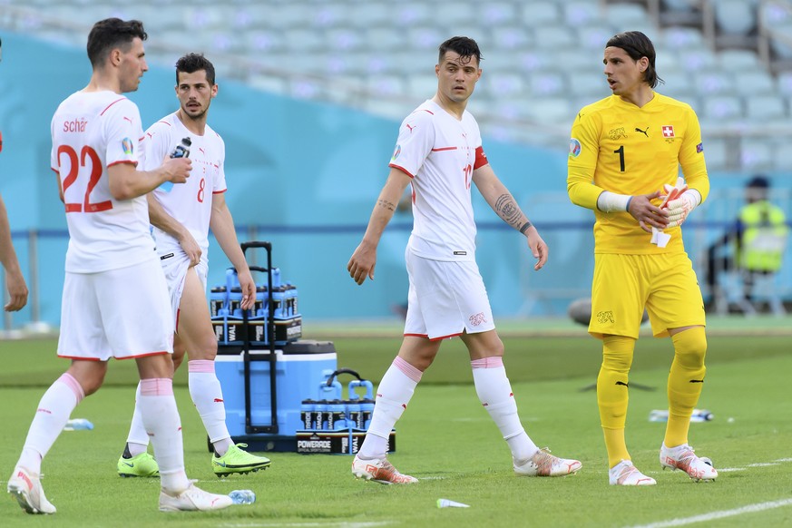 Switzerland&#039;s defender Fabian Schaer, Switzerland&#039;s midfielder Remo Freuler, Switzerland&#039;s midfielder Granit Xhaka, and Switzerland&#039;s goalkeeper Yann Sommer reacts after the draw 1 ...