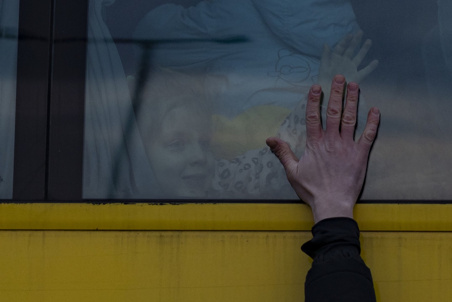 LVIV, UKRAINE - MARCH 03: A father says goodbye to his family as they leave for Poland on a bus on March 03, 2022 in Lviv, Ukraine. More than a million people have fled Ukraine following Russia&#039;s ...