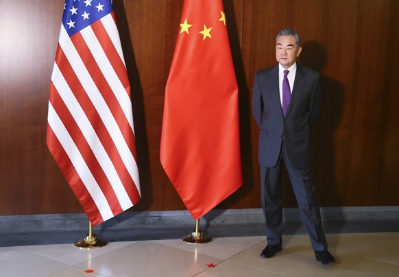 Chinese Foreign Minister Wang Yi waits U.S. Secretary of State Antony Blinken for their meeting at the Munich Security Conference, in Munich, Germany, Friday, Feb. 16, 2024. (Wolfgang Rattay/Pool Phot ...