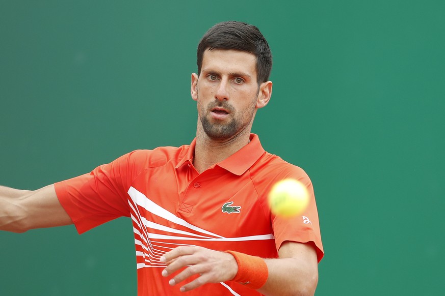 epa07510312 Novak Djokovic of Serbia in action during his second round match against Philipp Kohlschreiber of Germany at the Monte-Carlo Rolex Masters tournament in Roquebrune Cap Martin, France, 16 A ...