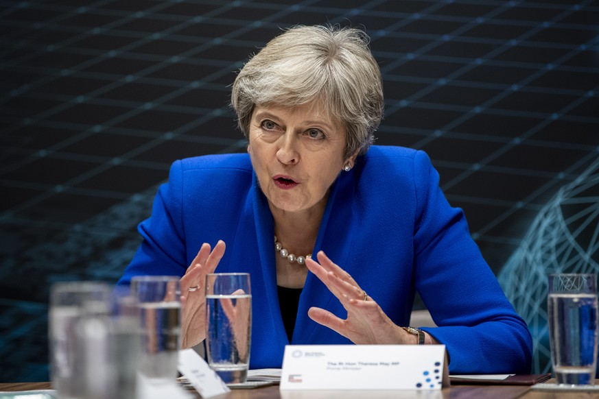 epa07012862 British Prime Minister Theresa May hosts a round table with business leaders at the Zero Emission Vehicle Summit in Birmingham, Britain, 11 September 2018. The summit will be attended by p ...