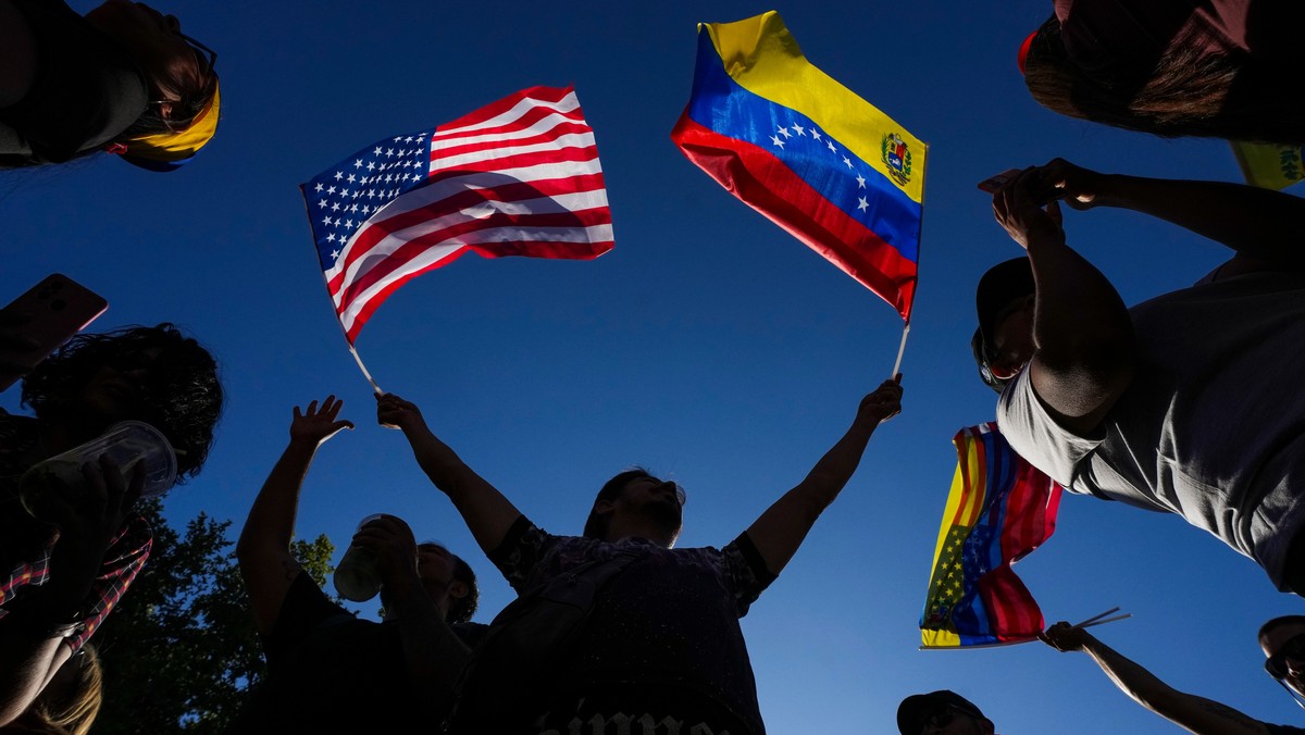 Venezuelans celebrate in Santiago, Chile, Saturday, Jan. 3, 2026, after U.S. President Donald Trump announced that President Nicolas Maduro had been captured and flown out of Venezuela. (AP Photo/Este ...