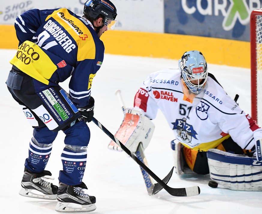 Ambri&#039;s player Peter Guggisberg scores from the penalty shot during the preliminary round game of National League A (NLA) Swiss Championship 2016/17 between HC Ambri Piotta and EV Zug, at the ice ...
