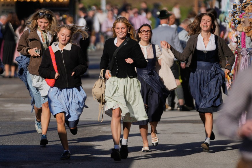 People run to enter the 191st Oktoberfest beer festival in Munich, Germany, Saturday, Sept.19, 2026. (AP Photo/Matthias Schrader)
Germany Oktoberfest Opening
