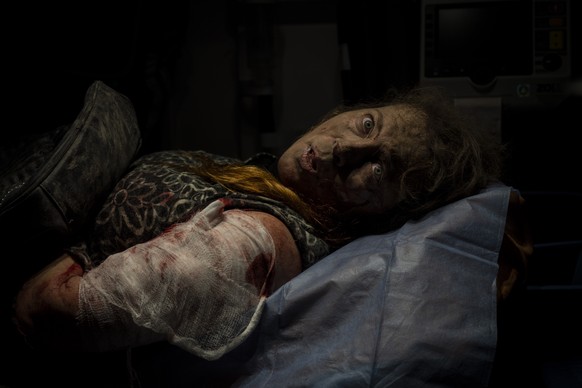 FILE - A resident wounded after a Russian attack lies inside an ambulance before being taken to a hospital in Kherson, southern Ukraine on Nov. 24, 2022. The widespread resolve against Russia's invasi ...