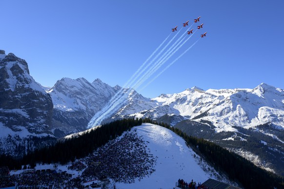Northrop F-5E Tiger II aircraft of the Patrouille de Suisse aerobatic team of the Swiss Air Force perform an aerobatic dispay ahead of the men&#039;s Downhill race at the Alpine Skiing FIS Ski World C ...