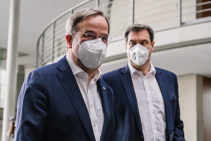 epa09128965 Christian Democratic Union (CDU) party chairman Armin Laschet (L) and State Premier of Bavaria and Christian Social Union (CSU) chairman Markus Soeder arrive for a joint press conference o ...