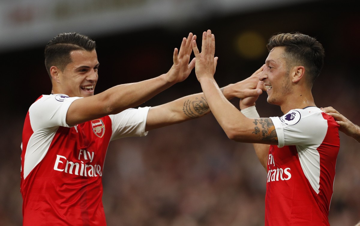 Britain Football Soccer - Arsenal v Chelsea - Premier League - Emirates Stadium - 24/9/16
Arsenal's Mesut Ozil celebrates scoring their third goal with Granit Xhaka
Action Images via Reuters /  ...