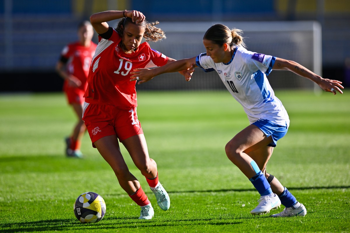 Switzerland's Iman Beney, left, and Israel's Noa Selimhodzic fight for the ball during a Women's World Cup qualifying semifinal playoff first leg soccer match between Israel and Switzer ...