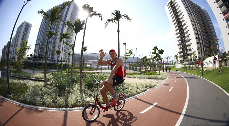 2016 Rio Olympics - Olympic Village - Rio de Janeiro, Brazil - 04/08/2016. A Canadian team member cycles during the Olympic Village media tour. Picture taken August 4, 2016. REUTERS/Jeremy Lee