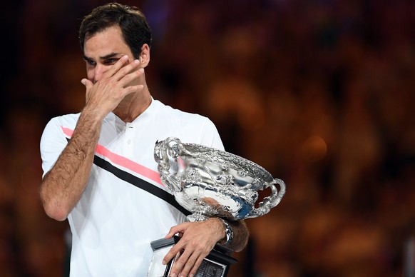 epa06480960 Winner Roger Federer of Switzerland reacts during the awarding ceremony of the men's final match at the Australian Open Grand Slam tennis tournament in Melbourne, Australia, 28 Januar ...