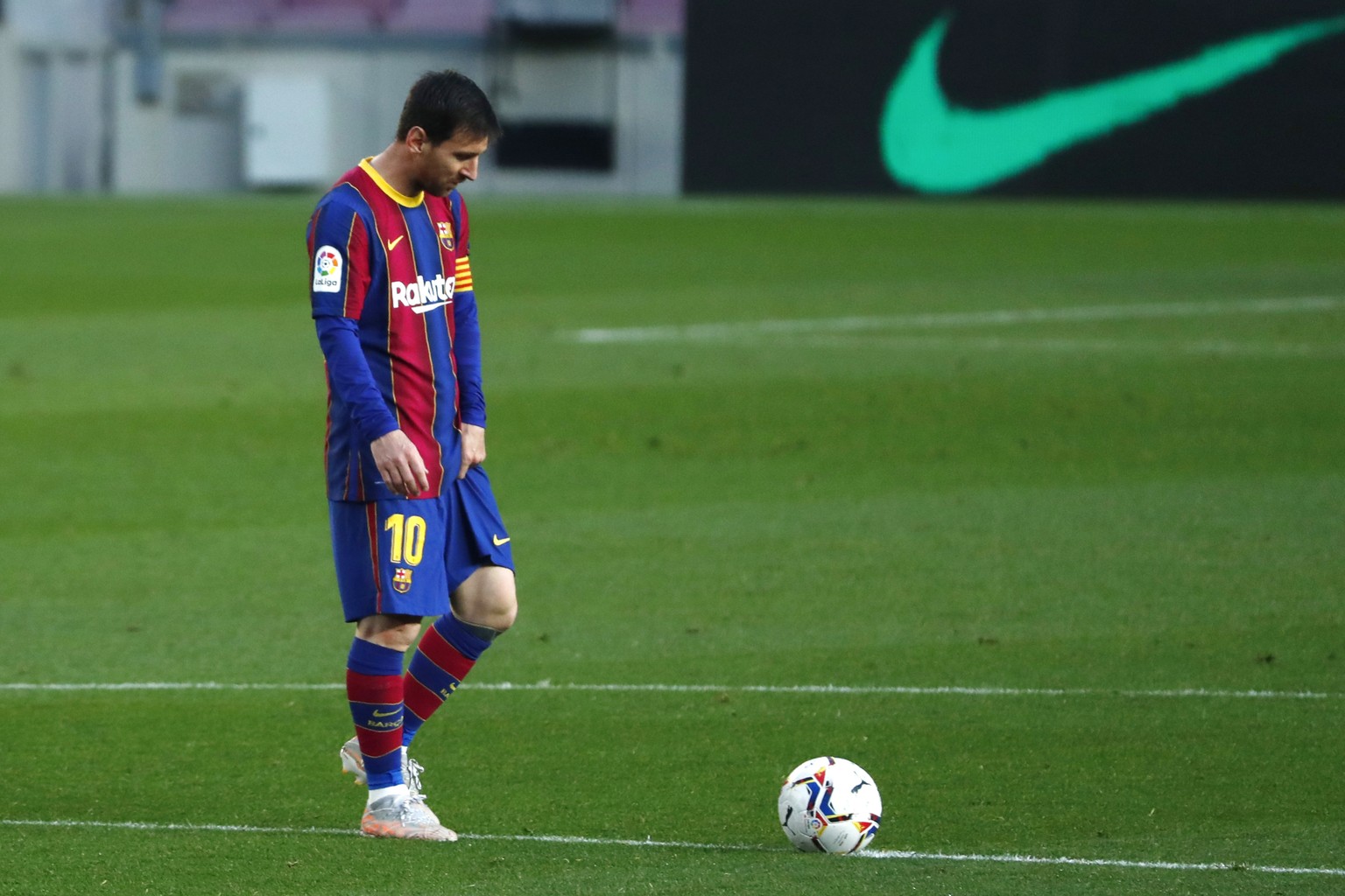 FILE - In this file photo dated Thursday, April 29, 2021, Barcelona&#039;s Lionel Messi reacts during the Spanish La Liga match against Granada at the Camp Nou stadium in Barcelona, Spain. Lionel Mess ...