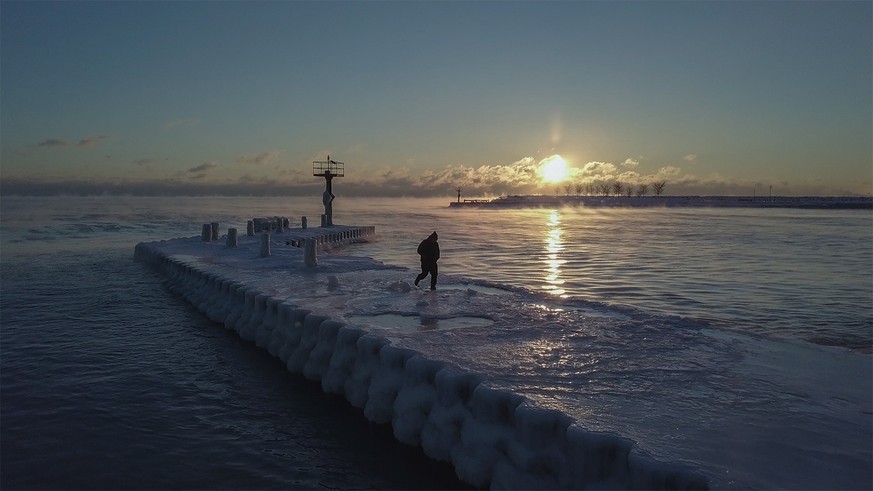 The sun rises, as seen from the 31st Street Beach in Chicago on Tuesday, Jan. 29, 2019. In Chicago, the forecast for Wednesday night called for temperatures as low as minus 21 degrees (negative 29 deg ...