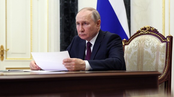 epa10664957 Russian President Vladimir Putin chairs a meeting with members of the government, via a video conference at the Kremlin in Moscow, Russia, 31 May 2023. The main topic of the meeting was is ...