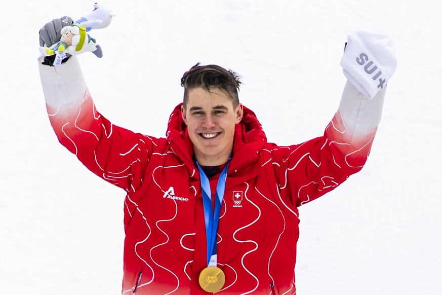 Gold medalist Franjo von Allmen of Switzerland poses on the podium after the men's alpine skiing Super-G race at the 2026 Olympic Winter Games at the Stelvio Ski centre in Bormio, Italy, on Wedne ...