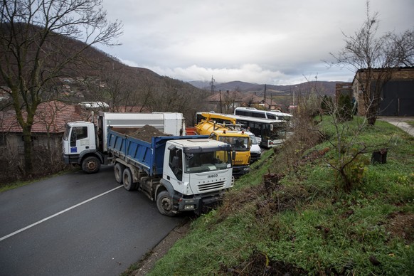 Heavy vehicles parked by local Serbs block the road in the village of Rudare, northern Kosovo, on Sunday, December 12.  11, 2022. Tensions were high in northern Kosovo on Sunday, with Serbs blocking roads after…