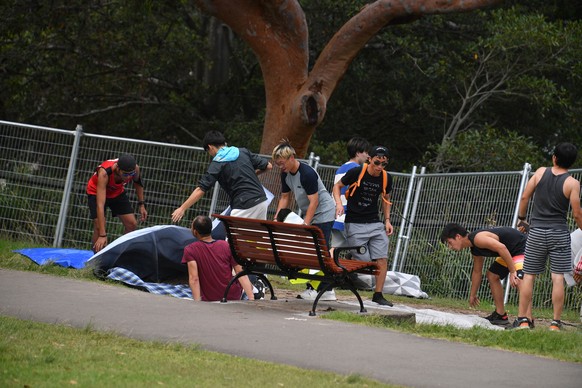 epa07254637 People are seen setting up at Mrs Macquarie&#039;s Point in preparation for New Years Eve Fireworks in Sydney, Australia, 31 December 2018. EPA/BRENDAN ESPOSITO AUSTRALIA AND NEW ZEALAND O ...