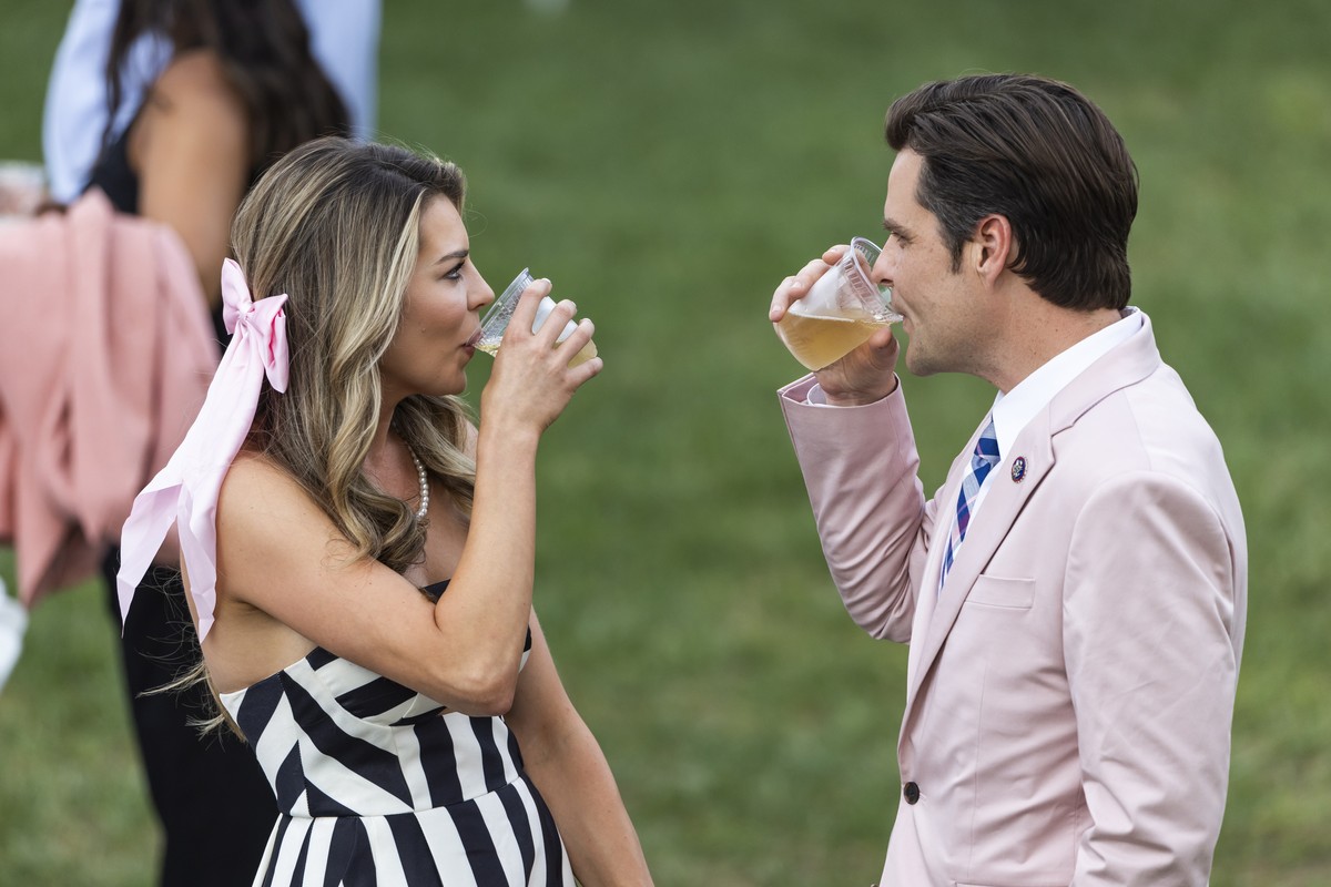 epa10756529 Republican lawmaker from Florida Matt Gaetz (R), along with his wife, Ginger (L), attends a Congressional picnic on the South Lawn of the White House in Washington, DC, USA, 19 July 2023.  ...