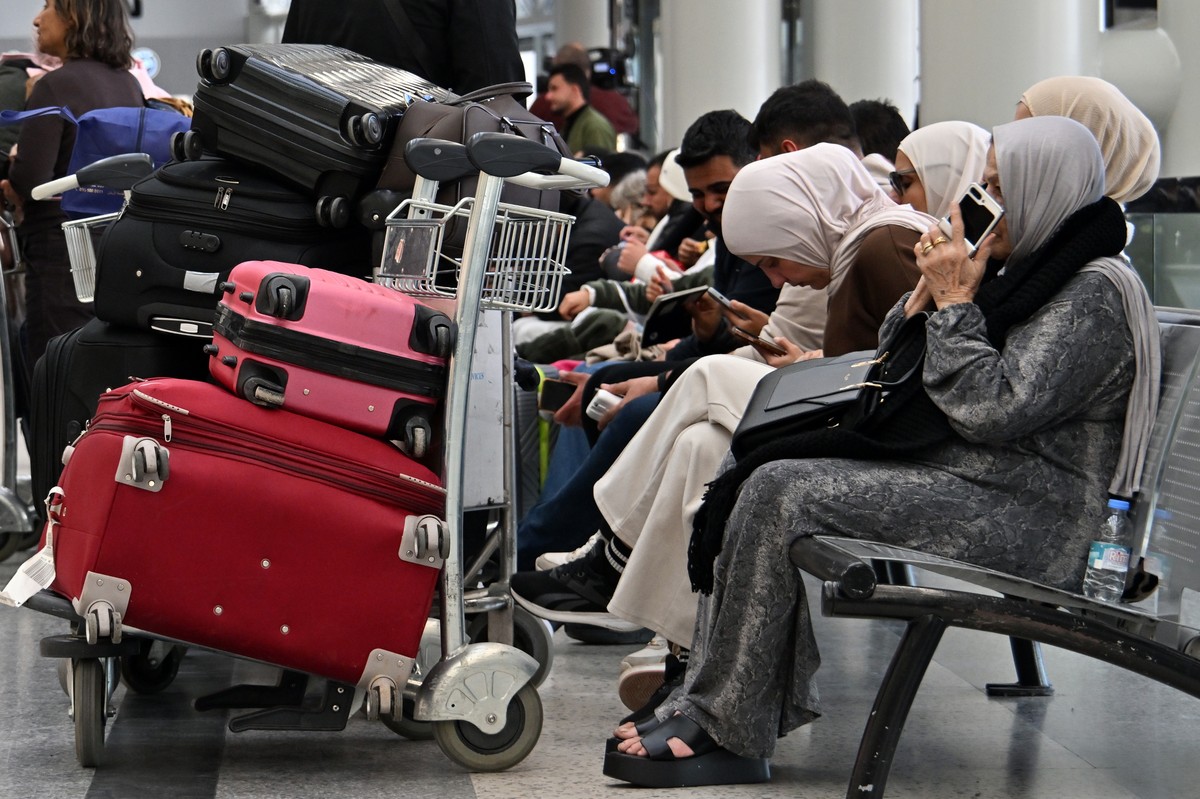 epa12783570 Passengers wait after their flights were delayed or canceled at Rafik Hariri International Airport in Beirut, Lebanon, 28 February 2026. Several flights to and from the airport were cancel ...