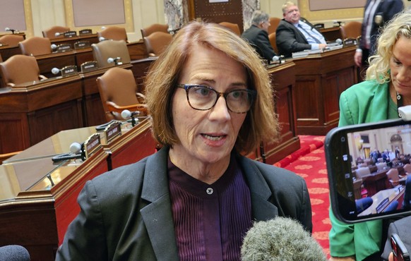 Minnesota Senate Democratic Majority Leader Erin Murphy talks with reporters on the Senate floor in the Minnesota State Capitol after a Republican attempt to expedite an ethics investigation of Democr ...