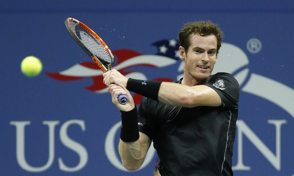 Andy Murray, of Britain, returns a shot to Thomaz Bellucci, of Brazil, during the third round of the U.S. Open tennis tournament in New York, Saturday, Sept. 5, 2015. (AP Photo/Julio Cortez)