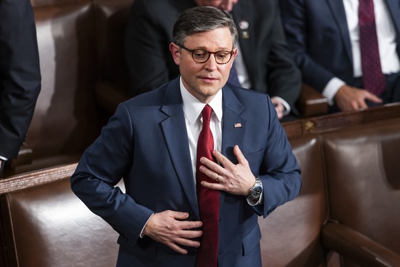 epa11804060 Republican Representative from Louisiana Mike Johnson reacts on the House floor after appearing to the lose the first round of votes to maintain his position as Speaker of the House at the ...