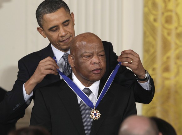FILE - In this Feb. 15, 2011, file photo, President Barack Obama presents a 2010 Presidential Medal of Freedom to Rep. John Lewis, D-Ga., during a ceremony in the East Room of the White House in Washi ...