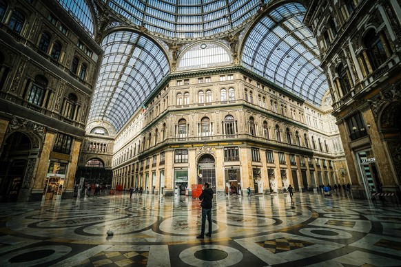 epa09056290 Few People walk on the streets and squares of the semi-deserted center of Naples, Italy, 06 March 2021. Campania Region returns to the Covid red zone from Monday 08 March. Too many daily c ...