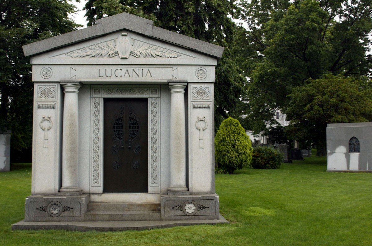 The tomb of infamous gangster, Charles "Lucky" Luciano, is seen, in St. John's cemetery, in the Queens borough of New York, Friday, June 14, 2002. The buiding glimpsed through the trees ...